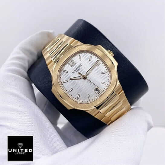 Patek Philippe Rose White Replica 1 Patek Philippe White Dial Yellow Gold Replica on the white glove hand