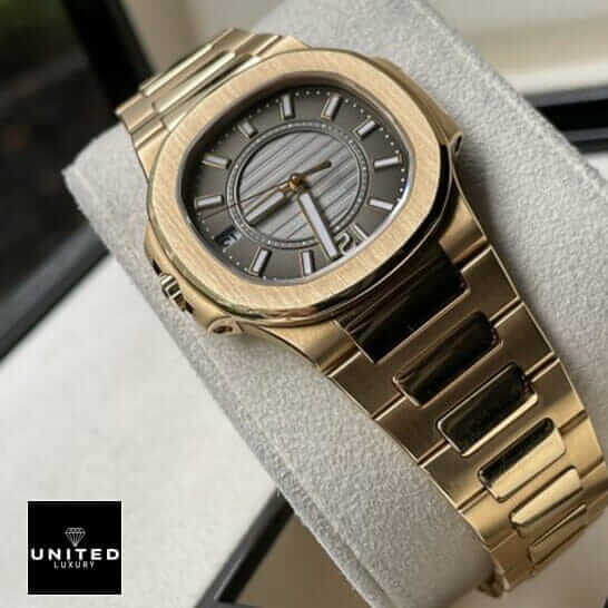 Patek Philippe Nautilus 7011/1R-010 Replica 3 Patek Philippe Black Dial Gold Bracelet Replica in the stand