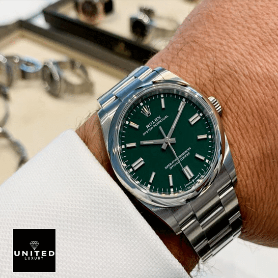 Rolex Oyster Perpetual Green Dial 126000-0005 Replica 1 Rolex Oyster Perpetual Green Dial 126000 Replica on his arm