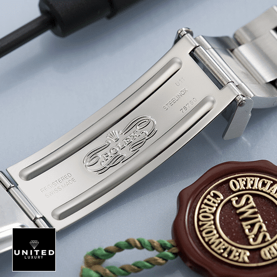 Rolex GMT-Master II Red & Black Bezel Black Dial Coke 16710 Oyster Replica 5 Rolex GMT-Master II Coke 16710 Replica Open Fold Clasp on the table