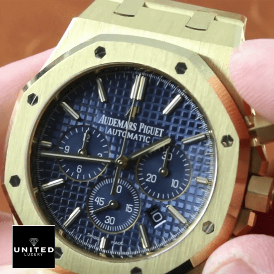 AP Yellow Gold Replica 6 Audemars Piguet Royal Oak Blue Dial Replica on the hand