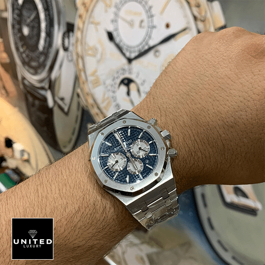 Audemars Piguet Royal Oak Chronograph 26331ST.OO.1220ST.01 Replica 6 Audemars Piguet Stainless Steel Blue Dial Replica on the man wrist watch background