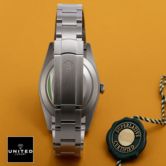 Rolex Oyster Perpetual Orange Dial 124300-0004 Replica 3 Rolex Perpetual 124300 Stainless Steel Oyster Bracelet Replica Fold Clasp on the Rolex Logo and Orange Background