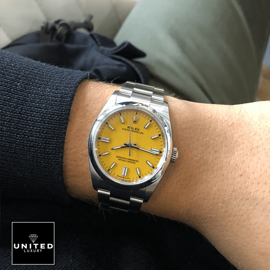 Rolex Oyster Perpetual Orange Dial 124300-0004 Replica 2 Rolex Perpetual 124300 Yellow Dial Stick indices Replica on his arm