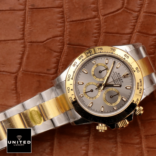 Floating Cosmo Daytona Replica 2 Rolex Daytona Cosmograph 116503 Stainless Steel & Yellow Gold Oyster Replica on the table